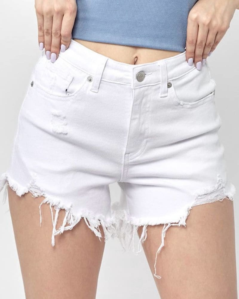 Front of a model wearing a size Large Denim High-Waisted Distressed Raw Hem Shorts In White in White by RISEN. | dia_product_style_image_id:351191